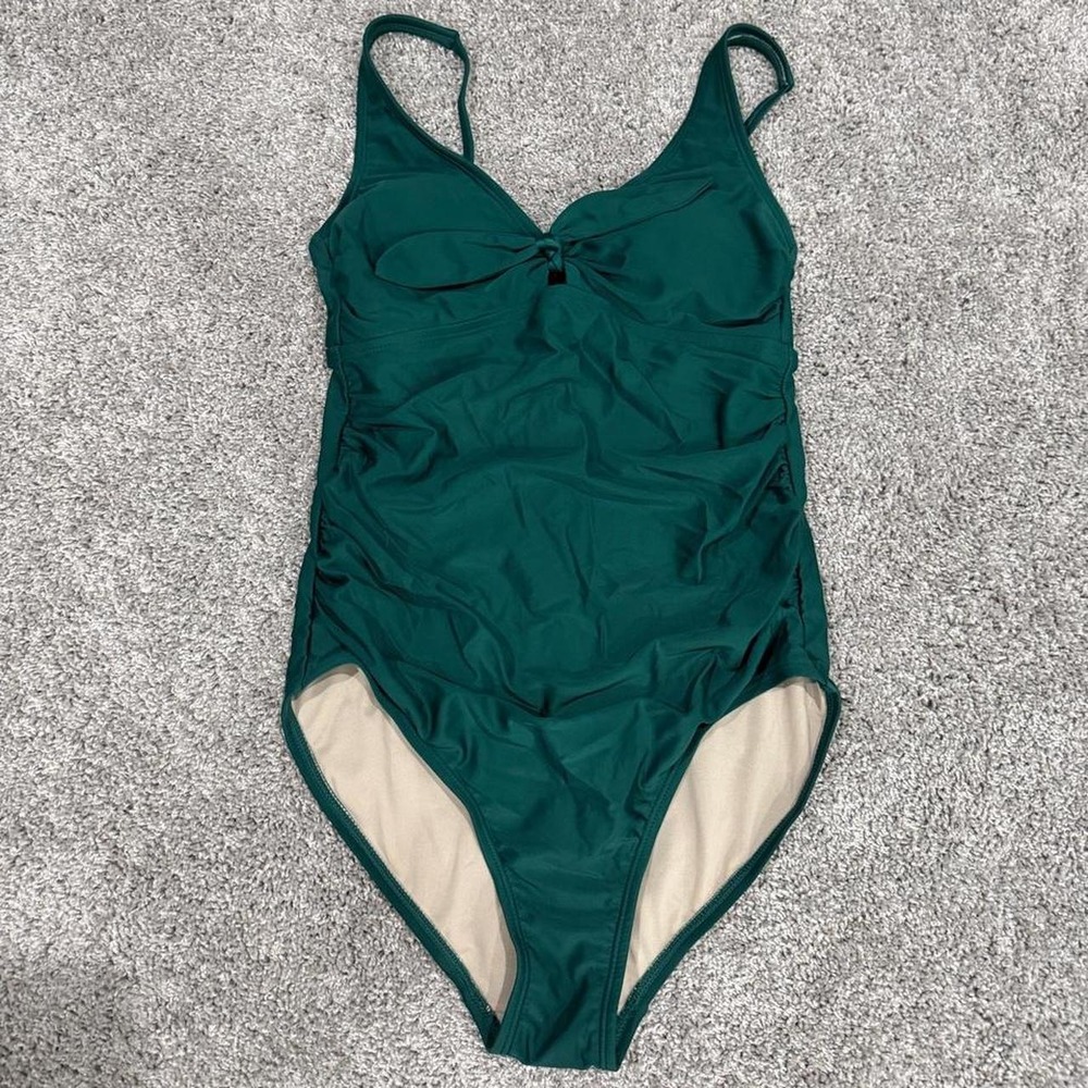 Kona sol one piece swimsuit in size M. Dark green with beige lining